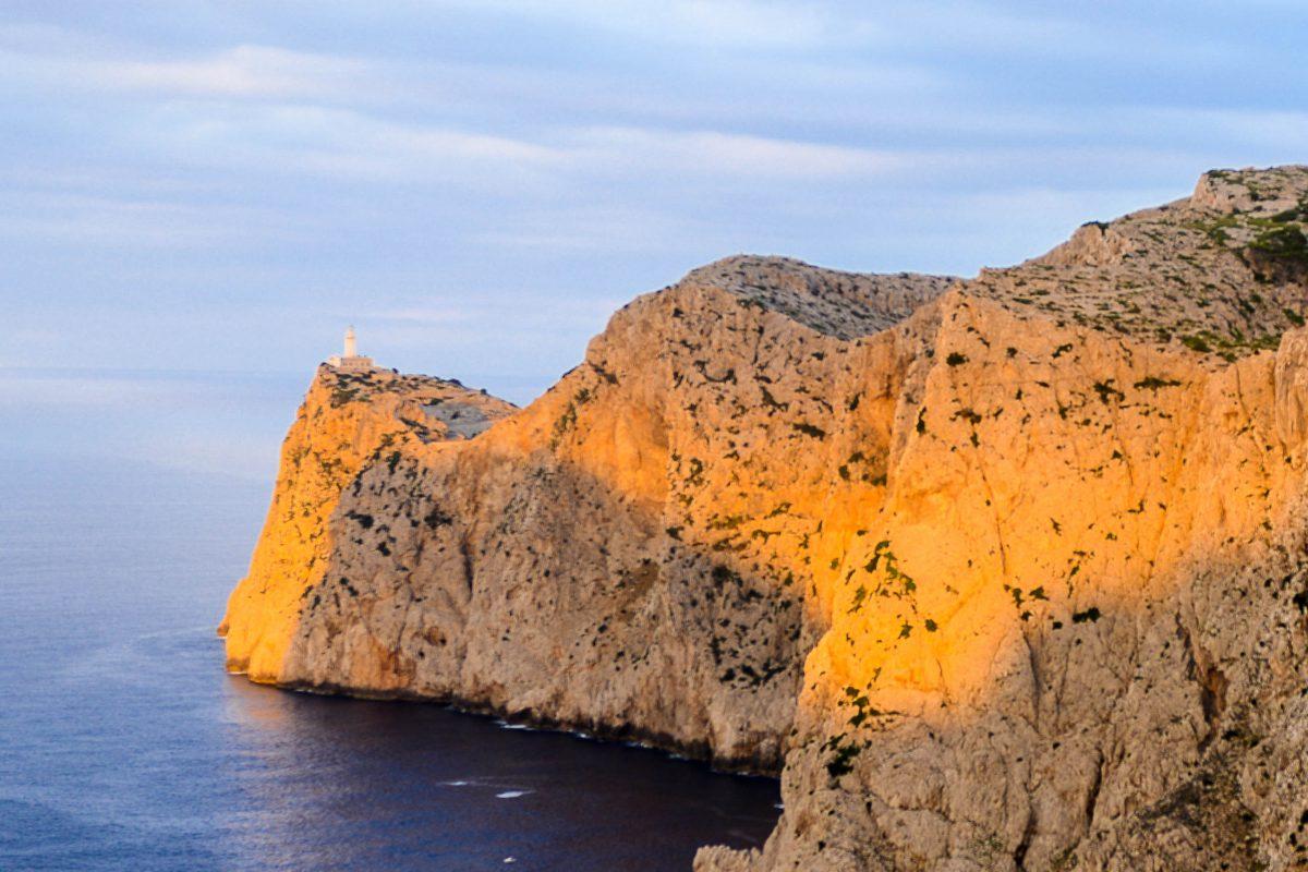 The lighthouse at Cap de Formentor has been perched since 1892 on a cliff hundreds of meters high, at the foot of which the sea roars incessantly, Mallorca, Spain - © James Camel / franks-travelbox